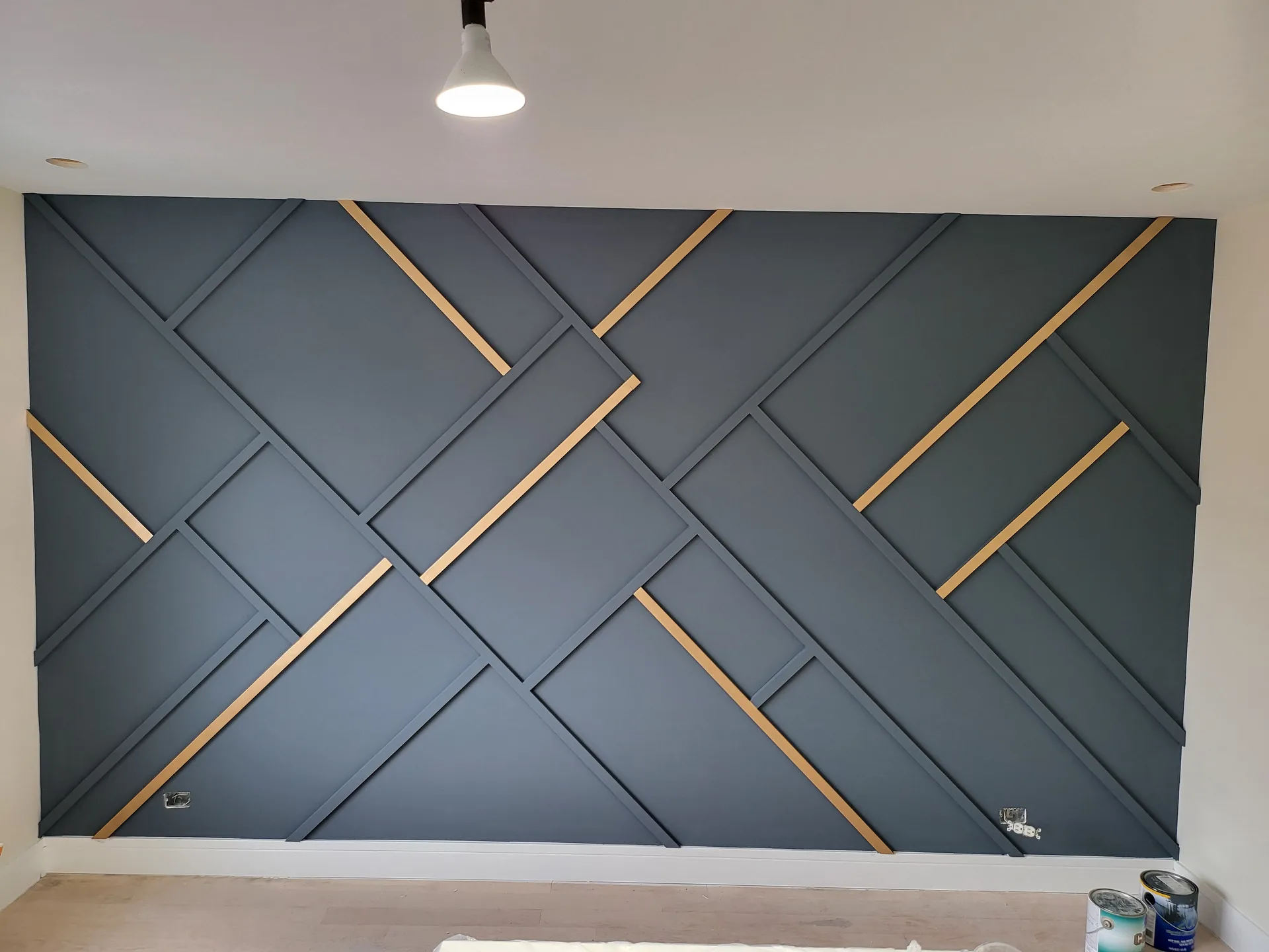 Navy slat accent wall with gold inlays