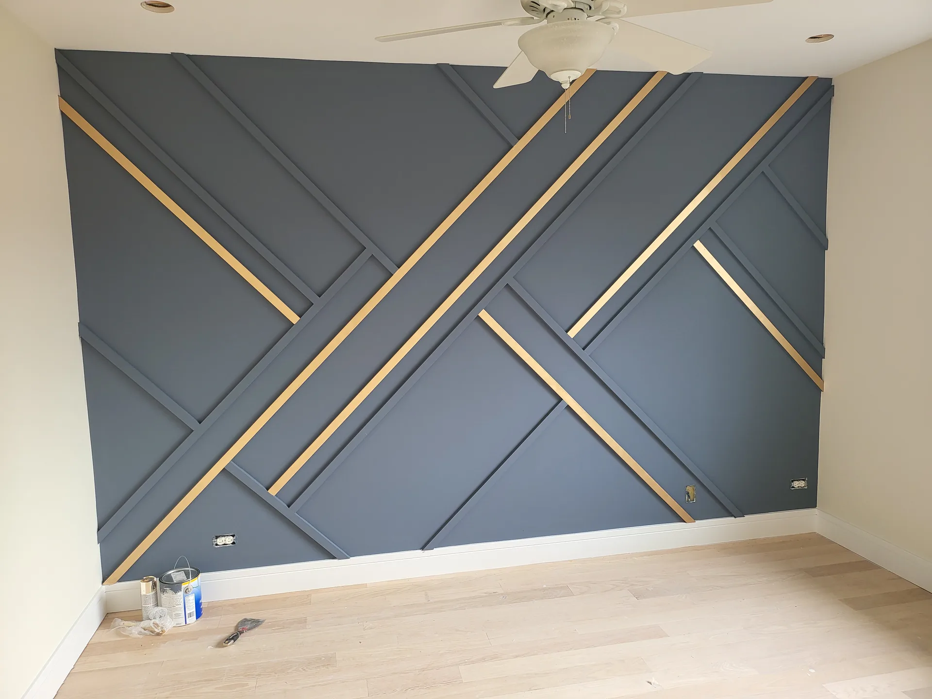 Slat accent wall navy gold inlay