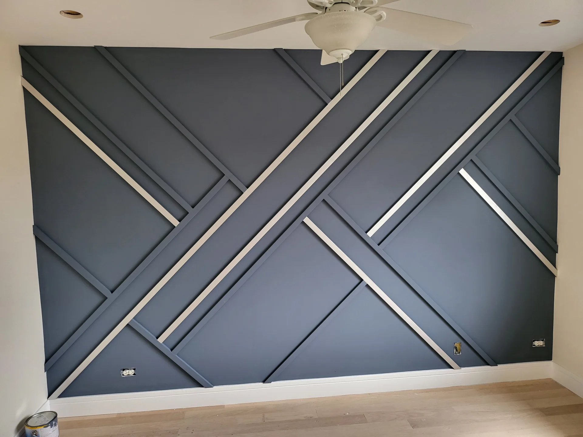 Navy slat accent wall with steel inlays