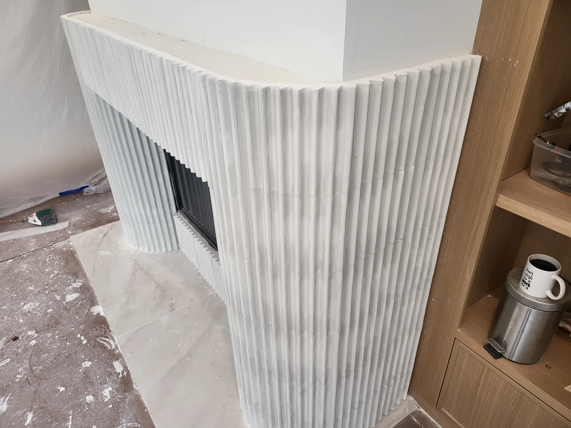 Curved fluted fireplace side view