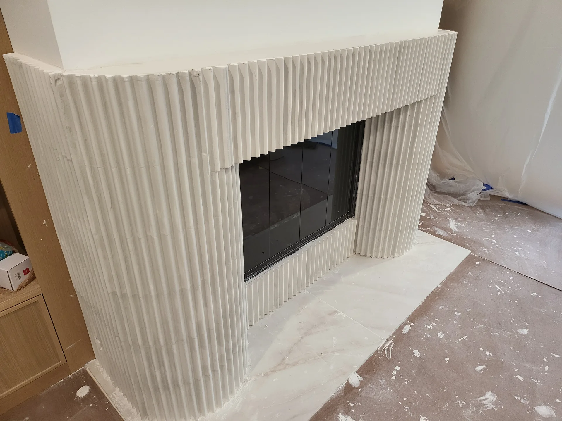 Fluted fireplace surround finished