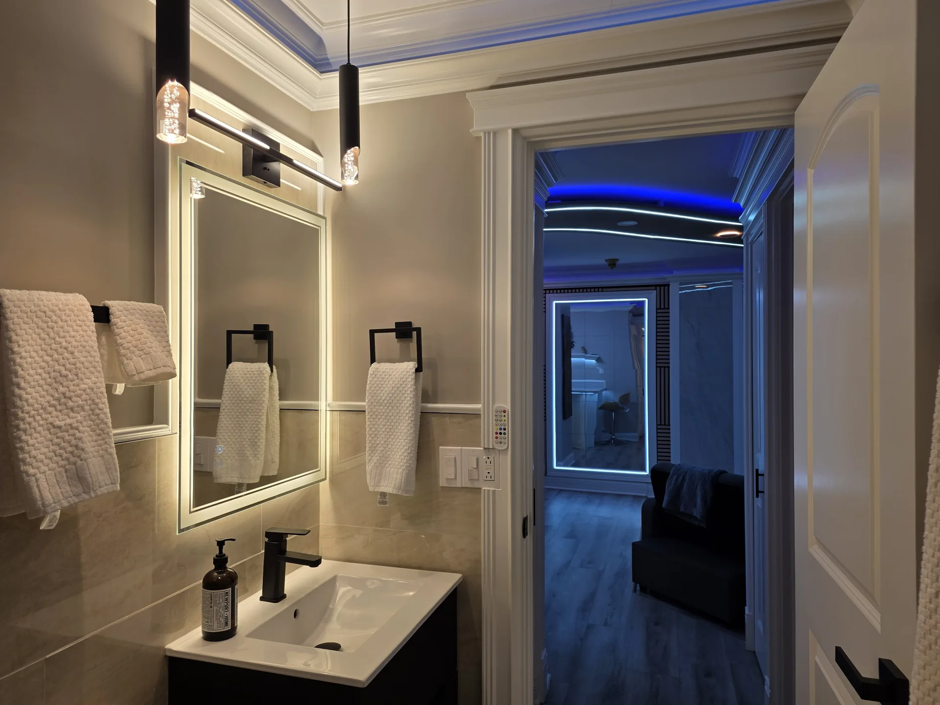 Bathroom backlit mirror black fixtures